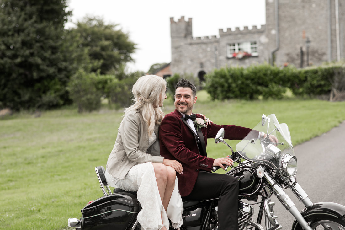 Groom with a bride on a chopper at Darver Castle 