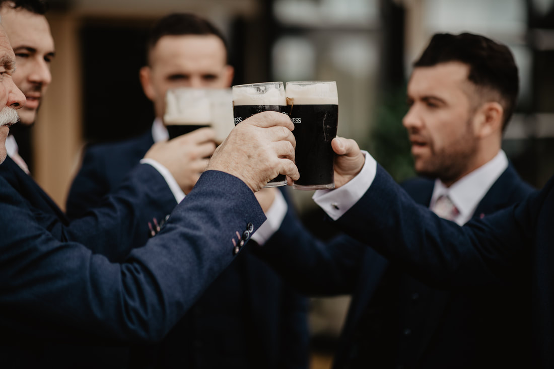 Groomsmen and Guinness, cheers at Clanard Court Hotel, Athy, Co. Kildare by wedding photographer Mario Vaitkus